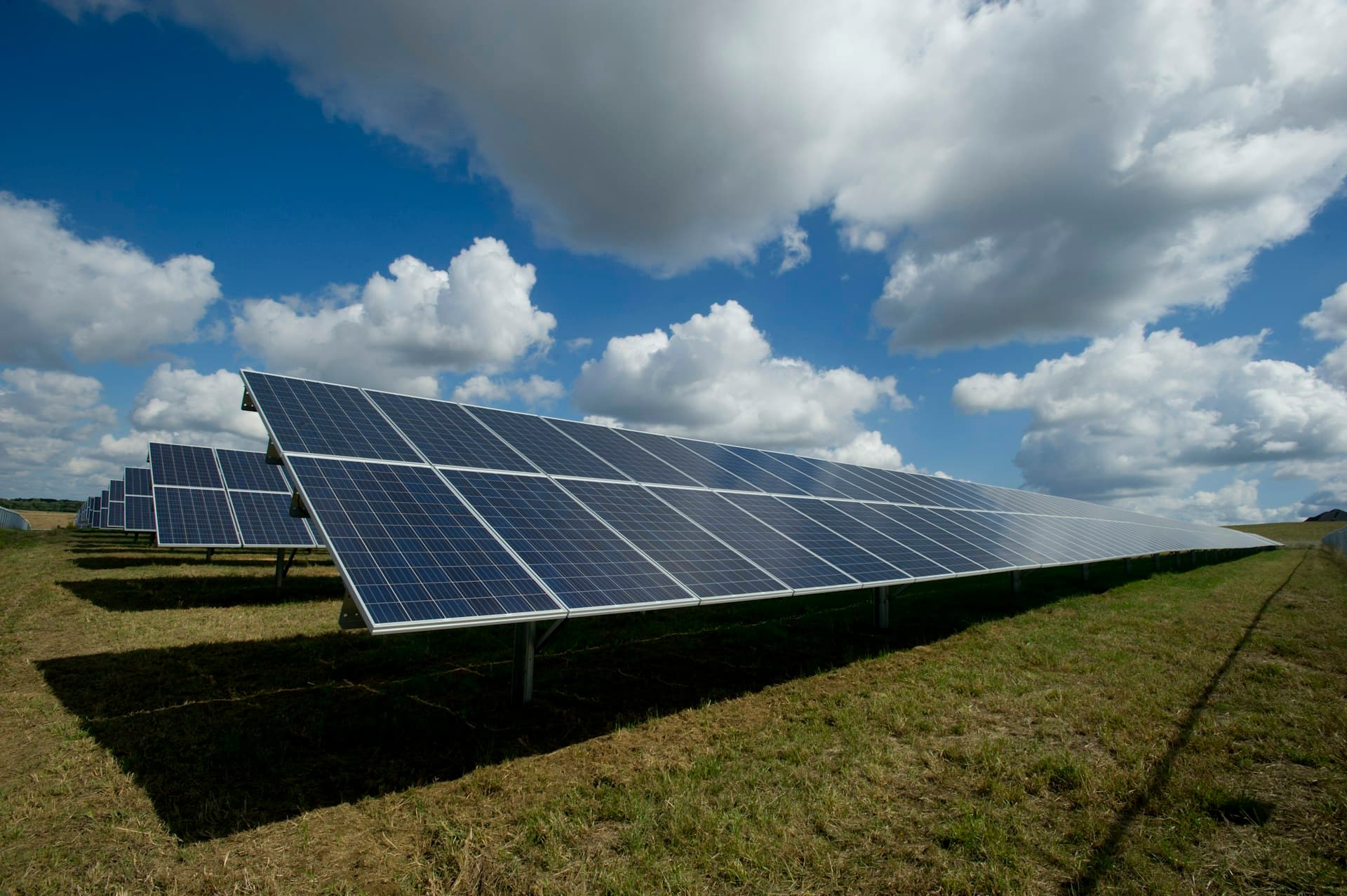 Utility-scale solar farm under a clear sky
